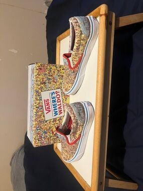 Vans Slip-On Sneakers in Multicolor Where's Waldo Print with Red Trim